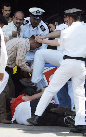 2006-5-21-egypt-police-kick-protester
