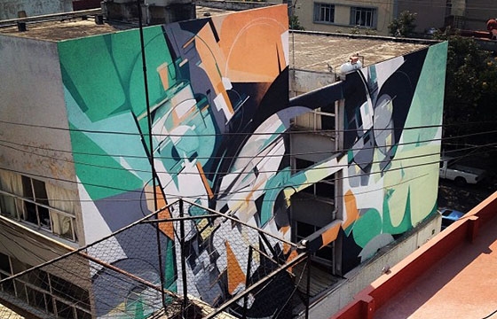 Kofie paints large building in Mexico City