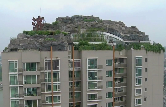 Man Builds Mountain Villa on Beijing Apartment Building