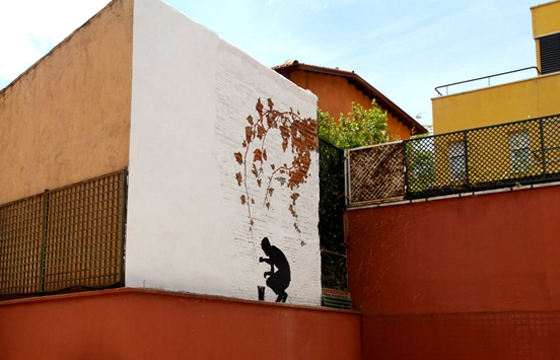 Painting branches mural by Pejac