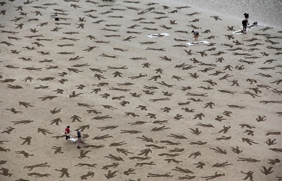 9,000 Stenciled Sand Silhouettes on Normandy Beach