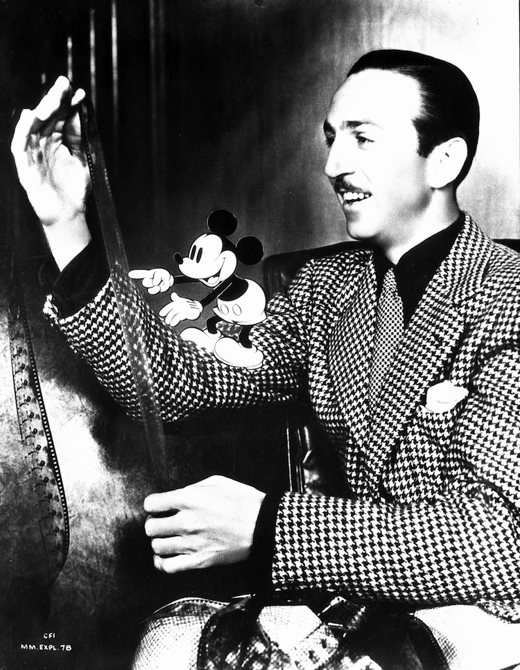 Walt Disney inspecting a filmstrip with an animated Mickey Mouse 1939 Exhibition Graphic Courtesy of the Walt Disney Archives Photo Library c Disney