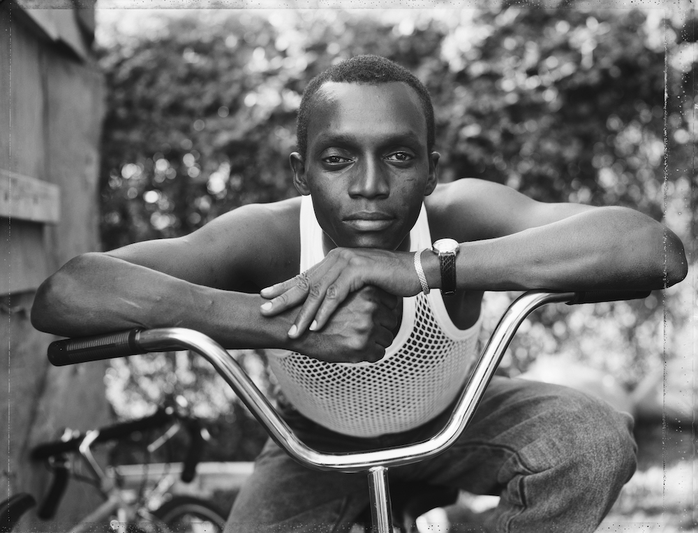 13. A Young Man Resting on an Exercise Bike Amityville NY 1988