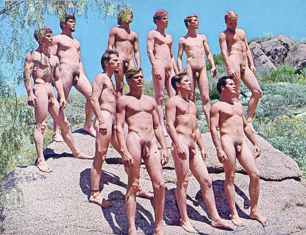 A-bunch-of-naked-men-standin-on-a-rock-in-the-1960s