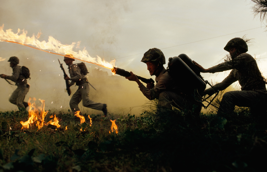 Marine infantry in Taiwan practice using flame throwers in a simulated battle, January 1969.Photograph by Frank and Helen Schreider, National Geographic