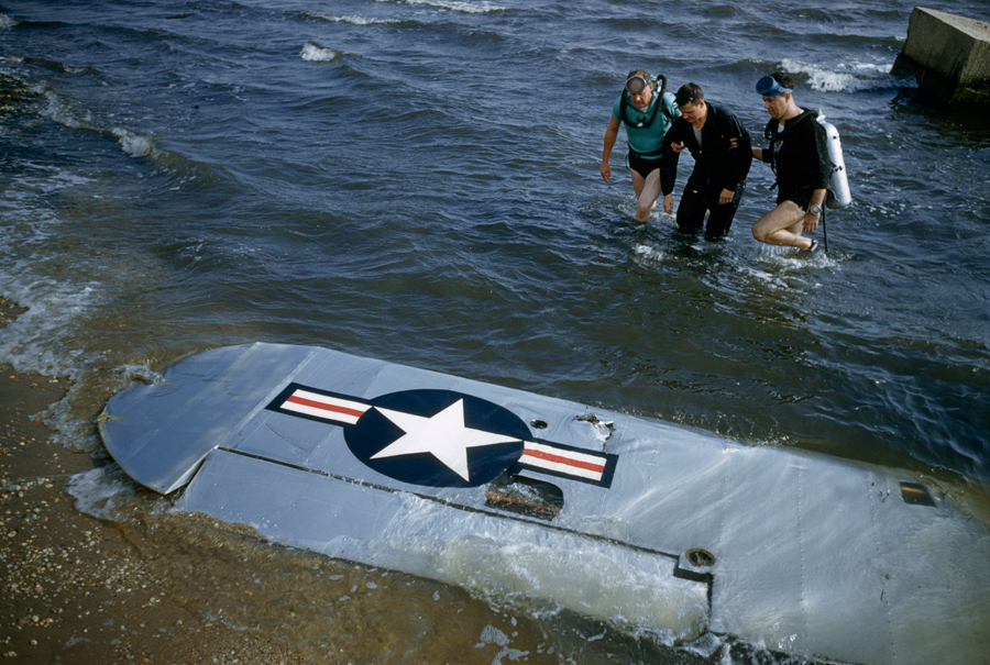 A Civil Air Patrol rescue team aids a pilot whose plane was downed outside of Long Island, May 1956.Photograph by Jack Fletcher, National Geographic