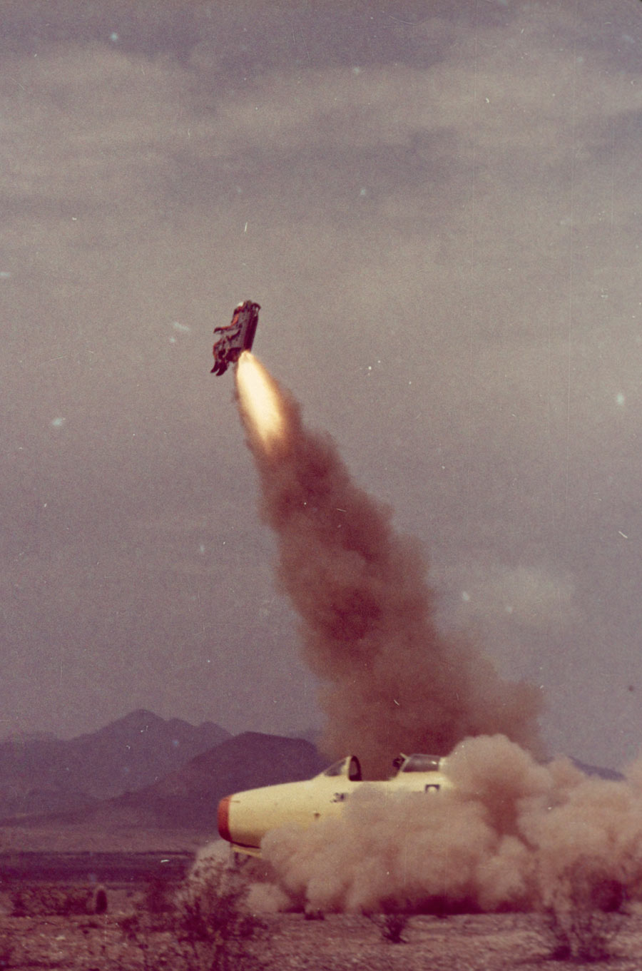 Dummy pilot and seat soar, as engineers test a catapult escape system in Arizona, March 1963. Photograph by Robert Sisson, National Geographic