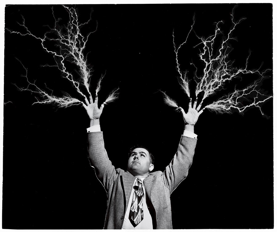 Electricity flashes from the thimble-topped fingers of a preacher-scientist, August 1955. Photograph by the Moody Bible Institute