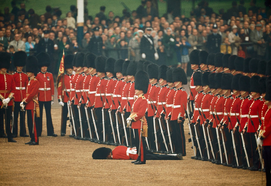 Irish Guards remain at attention after one guardsman faints in London, England, June 1966. Photograph by James P. Blair, National Geographic