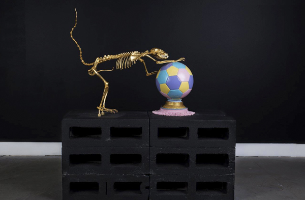 Juxtapoz Magazine - The Gilded Dinosaur Skeleton Installation