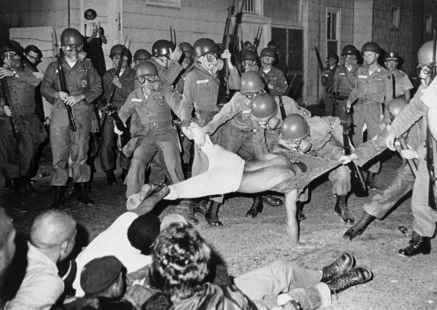 Clifford Vaughs, another photographer for the Student Nonviolent Coordinating Committee, being arrested by the National Guard. Cambridge, Md. 1964.