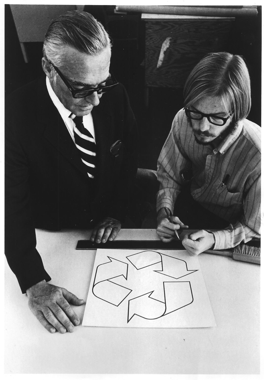 William Lloyd and Gary Anderson with the recycle symbol at the Container Corporation of America, 1971; photograph; 10 x 8 in.; collection of Gary D. Anderson.