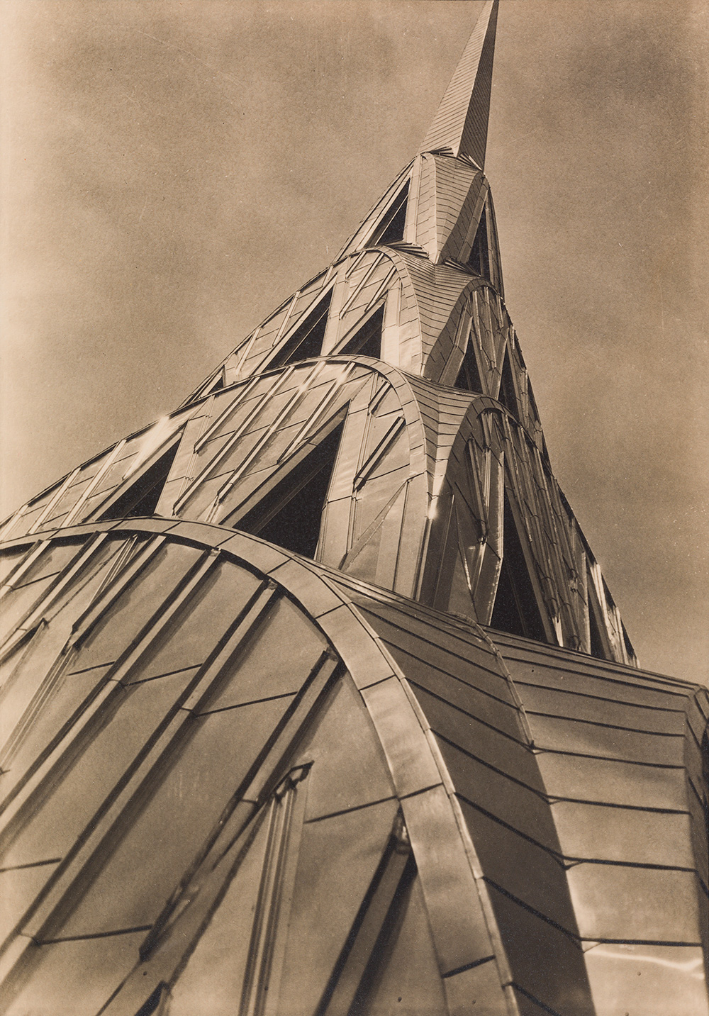 Margaret Bourke-White, "Chrysler Building: Tower," 1930. Gelatin Silver print, 5 3/8 x 3 7/8 in. (13.8 x 9.7 cm). San Francisco Museum of modern Art, Collection of the Sack Photographic Trust, ST1998.0071. Photograph by Don Ross © Estate of Margaret Bourke-White / Licensed by VAGA, New York, NY