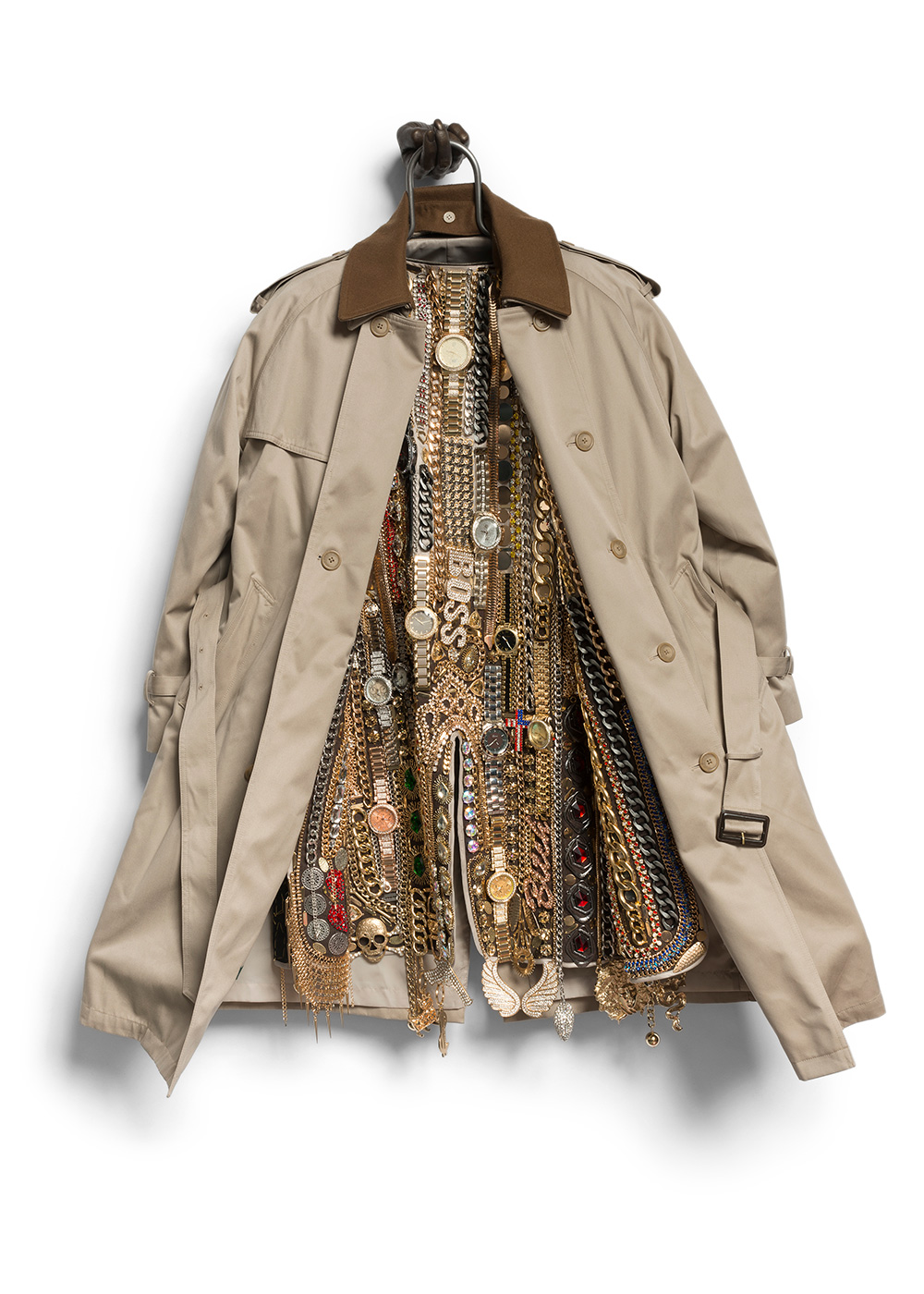 Nick Cave, Hustle Coat, 2017. Mixed media including a trench coat, cast bronze hand, metal, costume jewelry, watches, and chains. © Nick Cave. Courtesy of the artist and Jack Shainman Gallery, New York. Photo: James Prinz Photography.