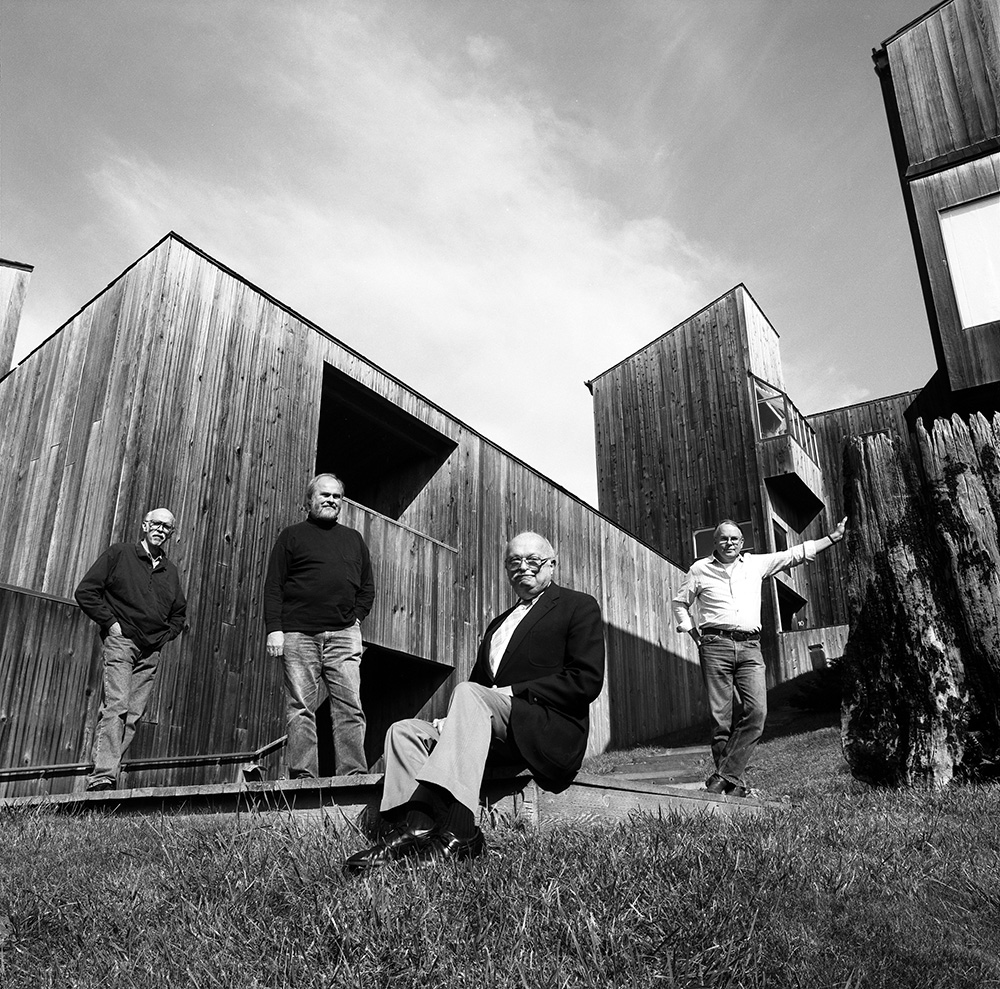 Richard Whitaker, Donlyn Lyndon, Charles Moore, and William Turnbull in Condominium One courtyard, photographed by Jim Alinder, 1991; Photo: Jim Alinder