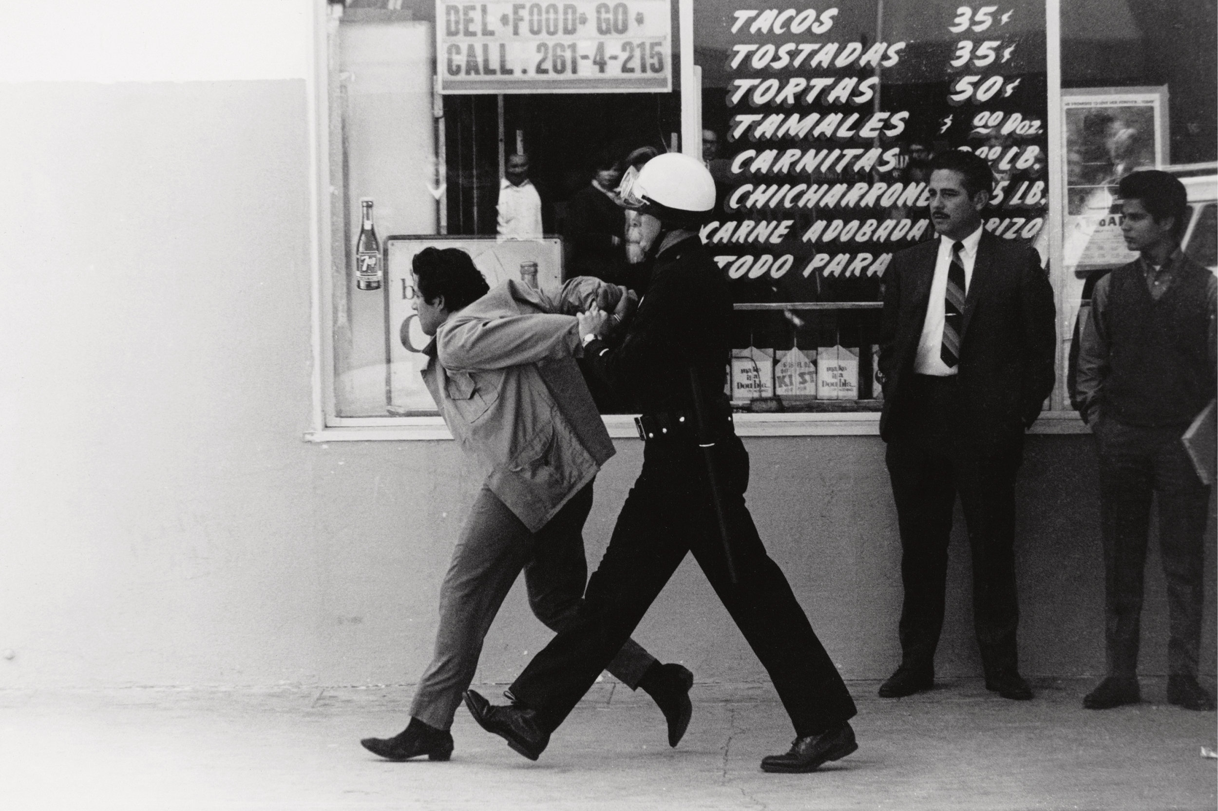 Los Angeles police arrest a Chicano student protester in the neighborhood of Boyle Heights in 1970. © George Rodriguez