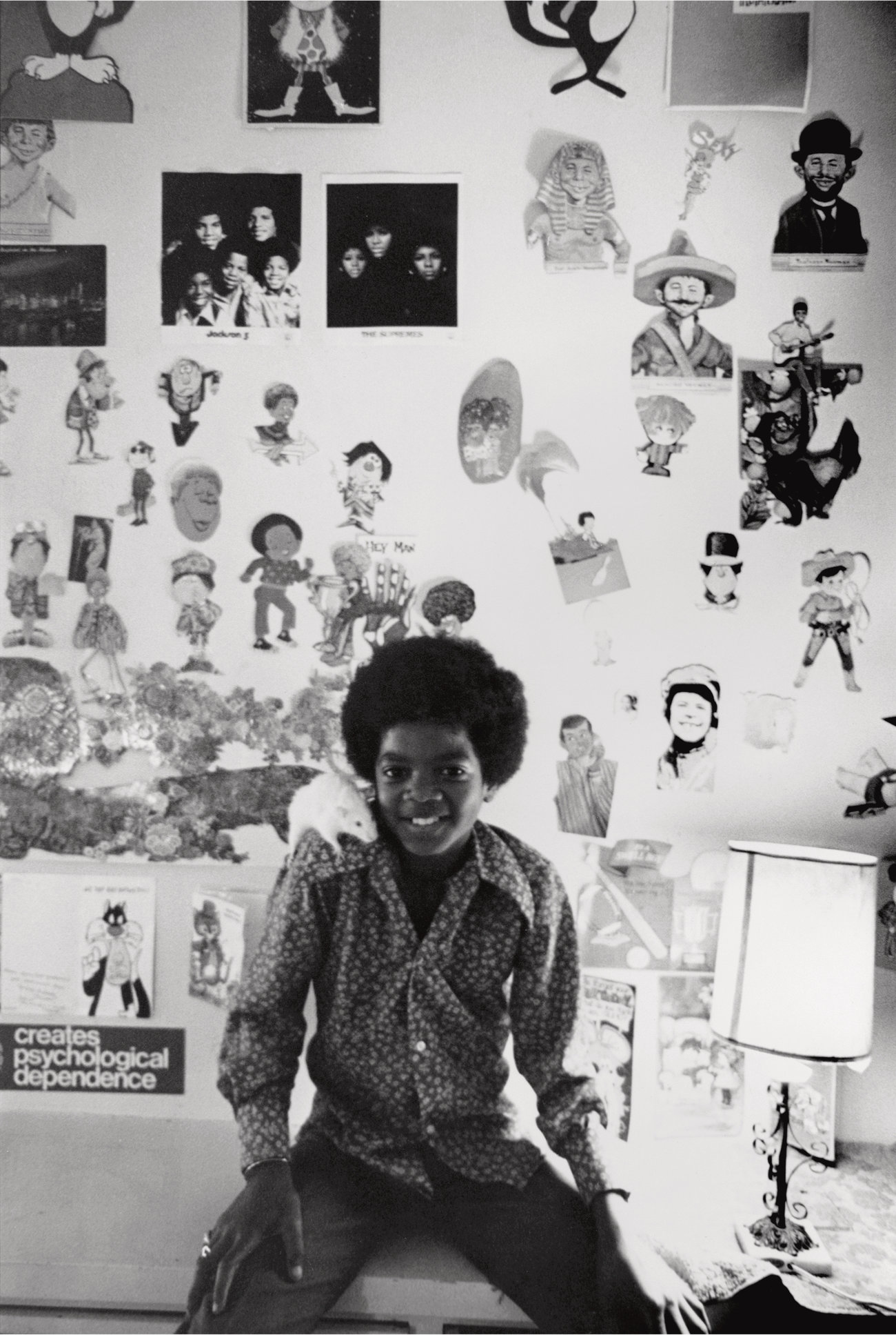 Michael Jackson sits in his room in his family