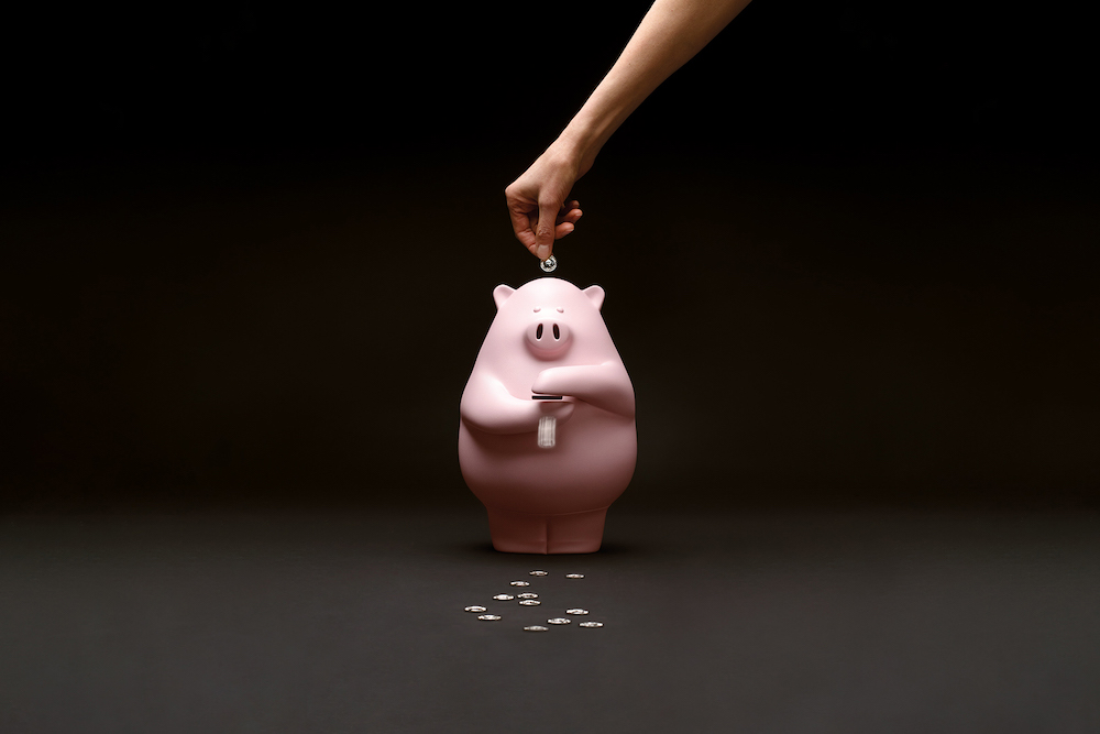 "SPENDY PIGS" Why save when you can make it rain!  This piggy bank shoots every coin you slip in there out through his hands.