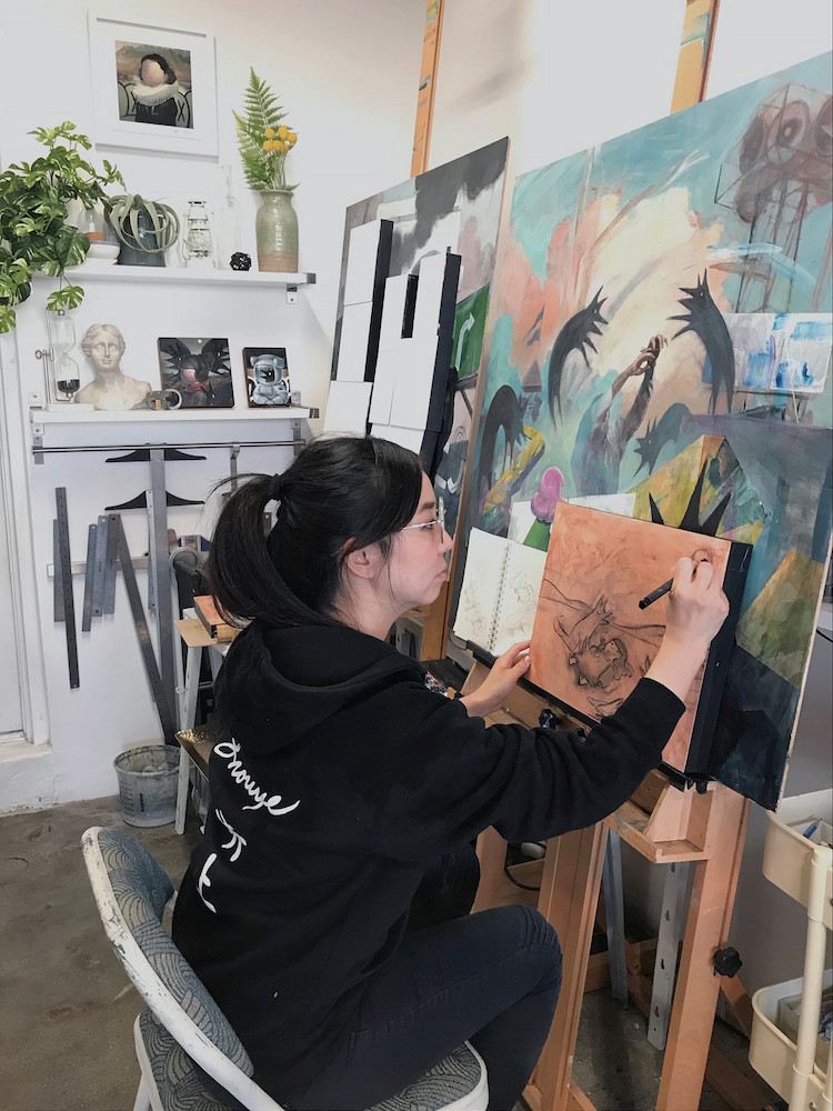 Trisha working on the sketch for ”Animal Control,” 2019. Oil on panel. 36 x 36 in.