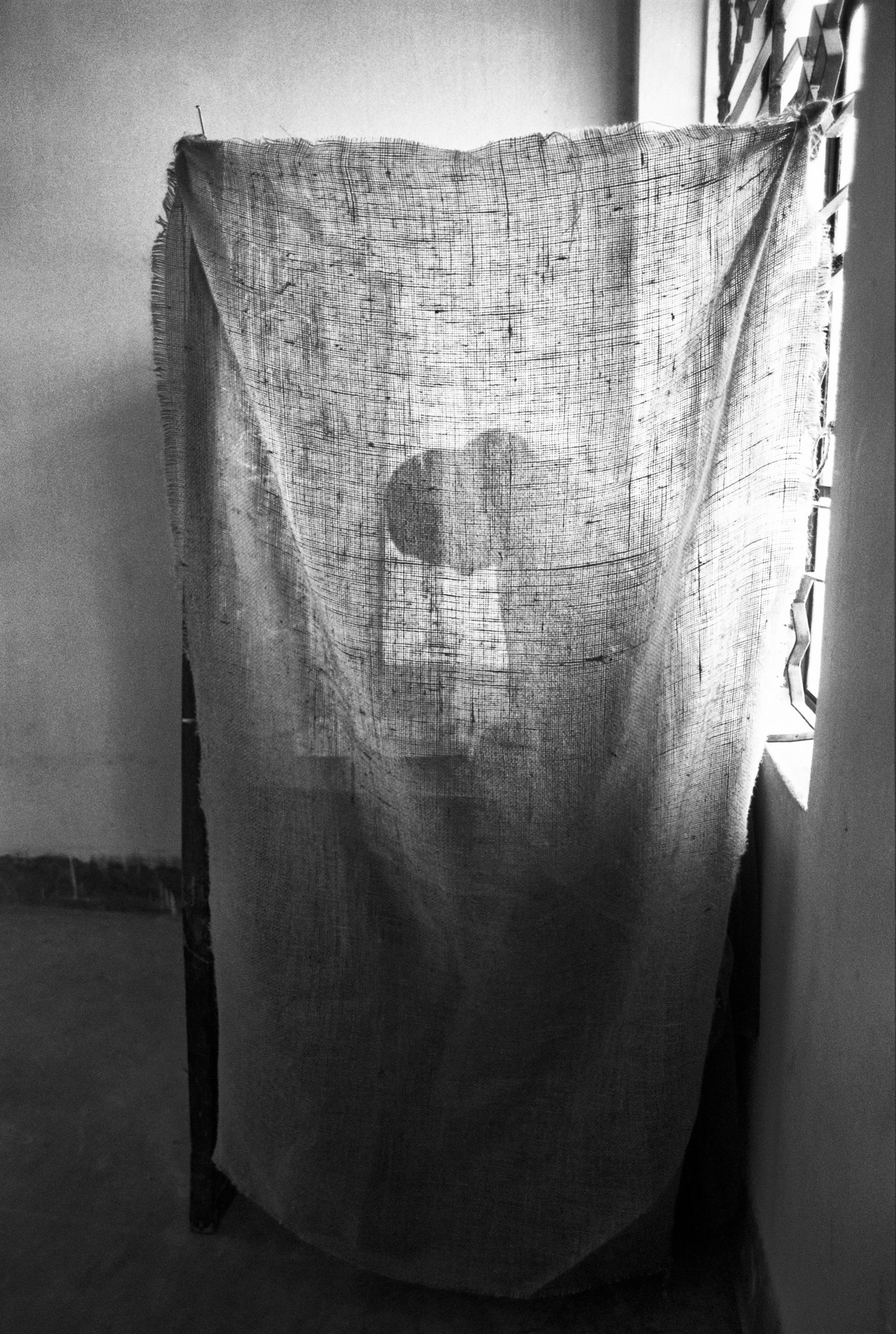 “Woman in Ballot Booth (Lamatia, Dhaka, Bangladesh)” 1991.