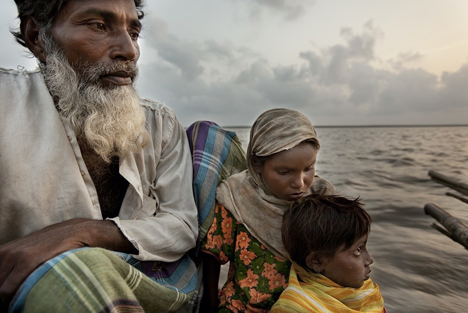"Climate Refugees; river crossing between Bondor Tila Ghat in Mijhum Dwip and Moktaria Bazar in Hatiya, Bangladesh" 2009.