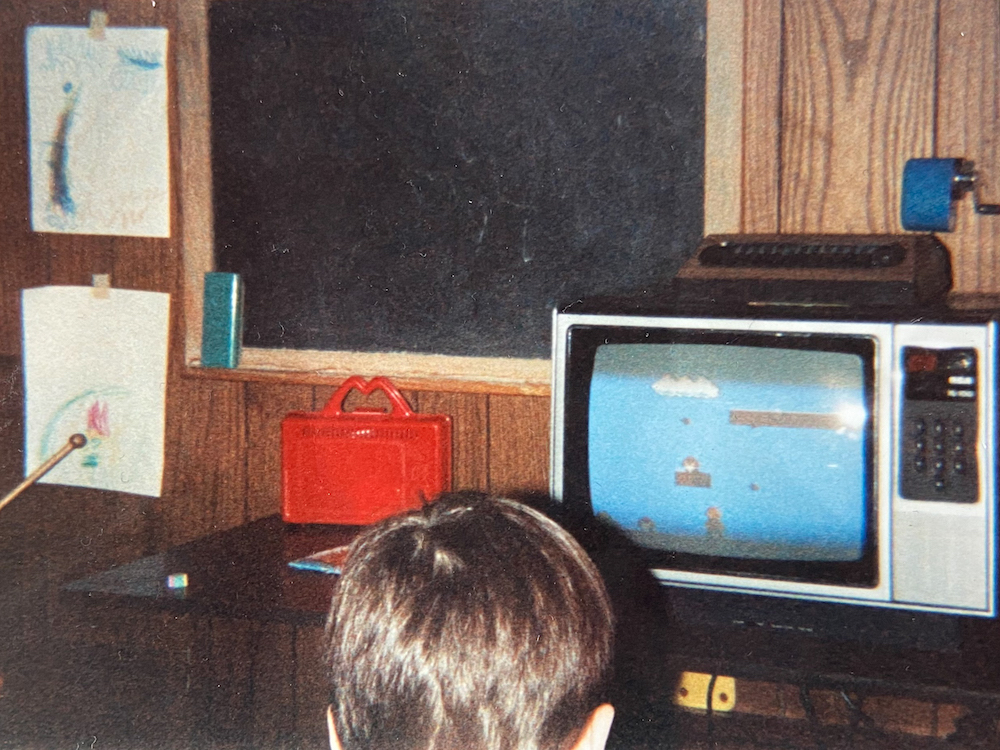 Ryan playing Super Mario Bros  in a wood paneled basement, Long Island, 1990