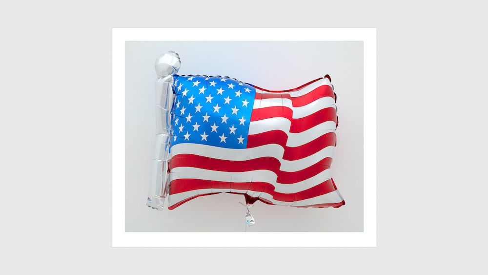 Jeff Koons Flag, 2020  Archival pigment print on Innova rag paper  25 5/8 x 31 inches 65.1 x 78.7 cm Framed: 28 5/8 x 34 inches 72.7 x 86.4 cm      Edition of 40, 10 AP  Signed, dated, and numbered recto     © Jeff Koons. Courtesy the artist and David Zwirner   Edition of 40, 10 AP Signed, dated, and numbered recto     © Jeff Koons. Courtesy the artist