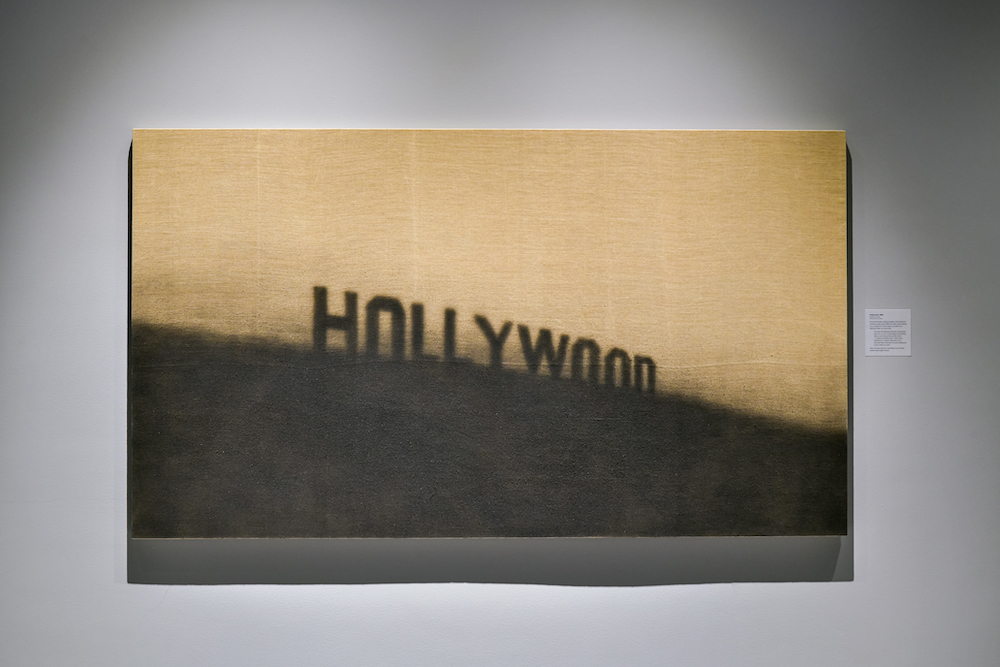 Hollywood, 1999 Acrylic on linen 48 x 84 in. (121.9 x 213.4 com) Collection of the artist © Ed Ruscha Photo: Trayson Conner.