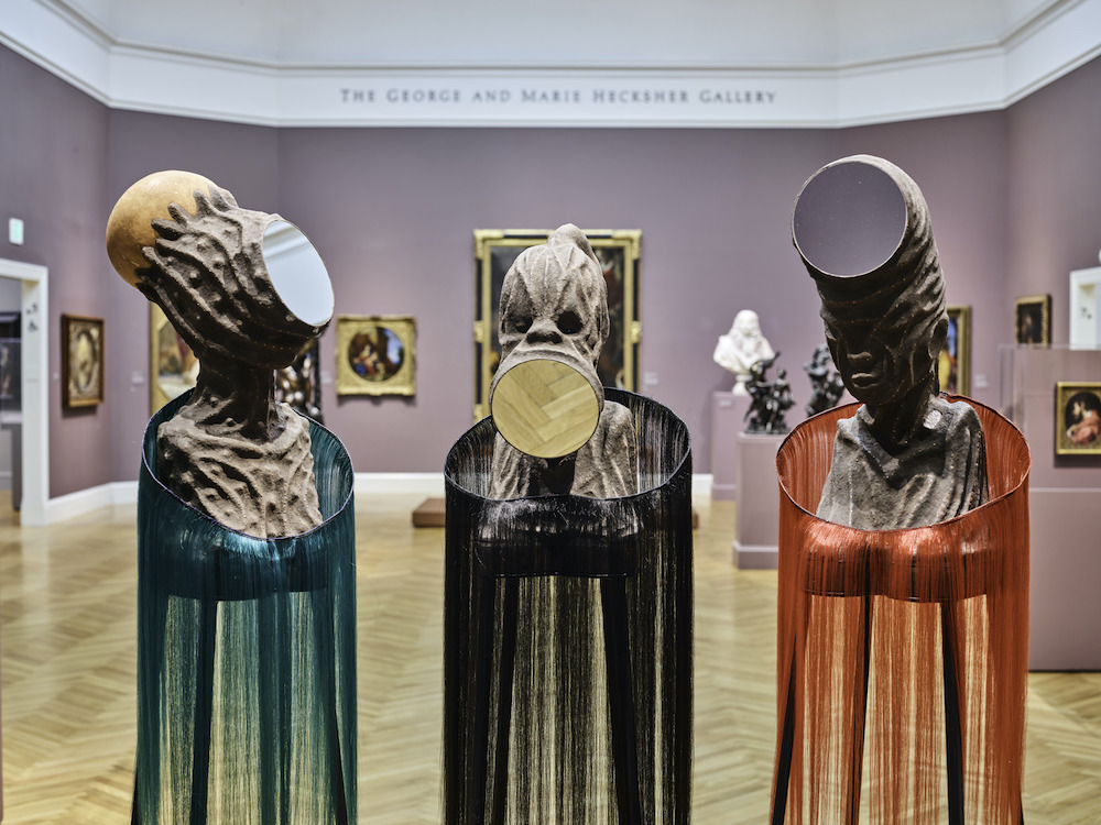Installation view from Wangechi Mutu: I Am Speaking, Can You Hear Me?, Legion of Honor, San Francisco, 2021. Photograph by Randy Dodson, courtesy of the Fine Arts Museums of San Francisco  Mirror Faced I, 2020, Mirror Faced II, 2020, and Mirror Faced III, 2020, © Wangechi Mutu. All rights reserved. Courtesy the Artist and Gladstone Gallery, New York and Brussels