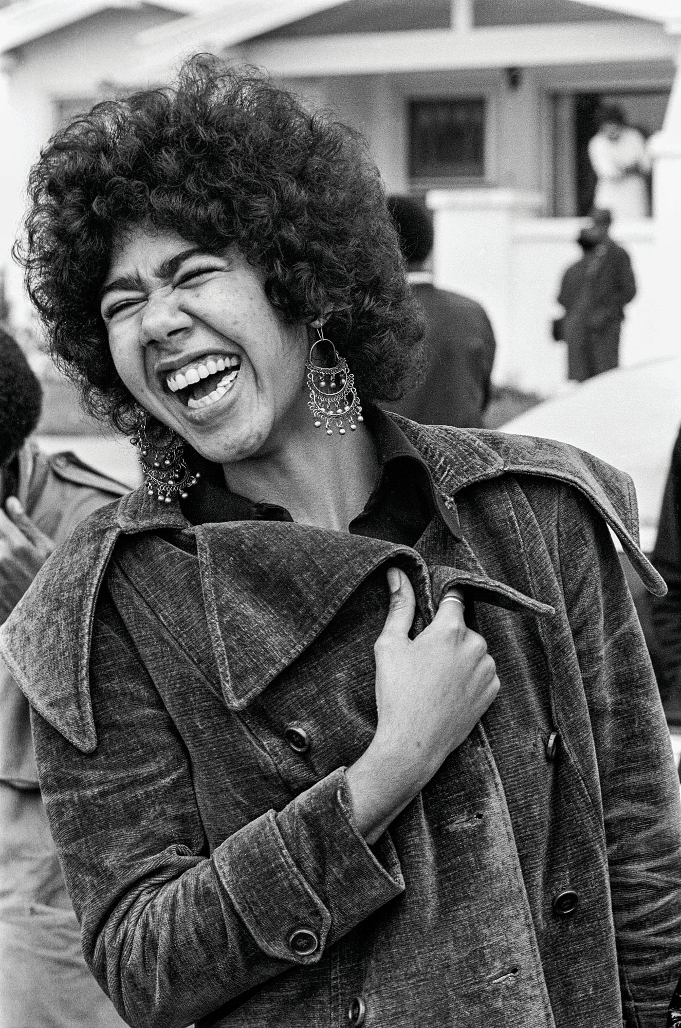 March 31, 1972 - Oakland, California, USA: Black Panther member Ericka Huggins laughs with comrades after the Black Community Survival Conference. She served in the Los Angeles, New Haven, and Oakland offices of the party.