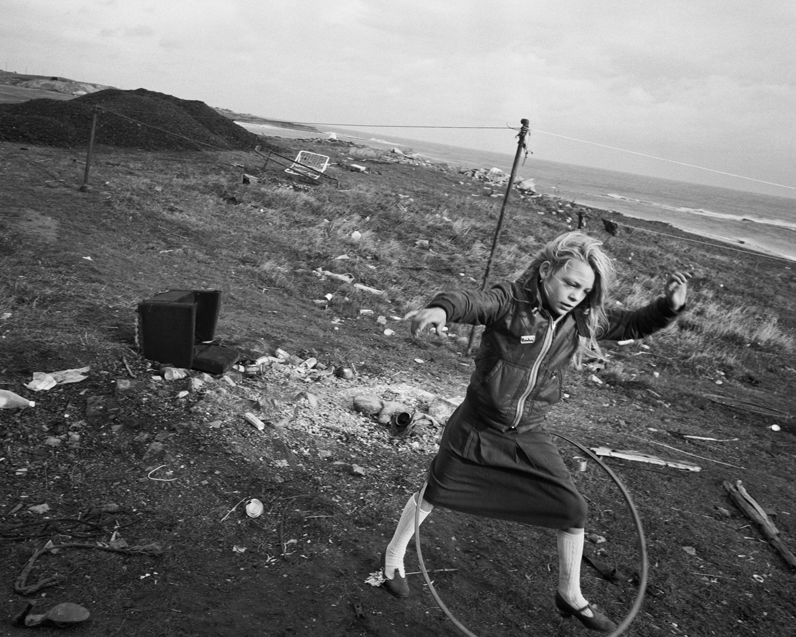 Chris Killip, “Helen and her Hula-hoop”, Seacoal Camp, Lynemouth, Northumbria (1984) © Chris Killip Photography Trust/Magnum Photos