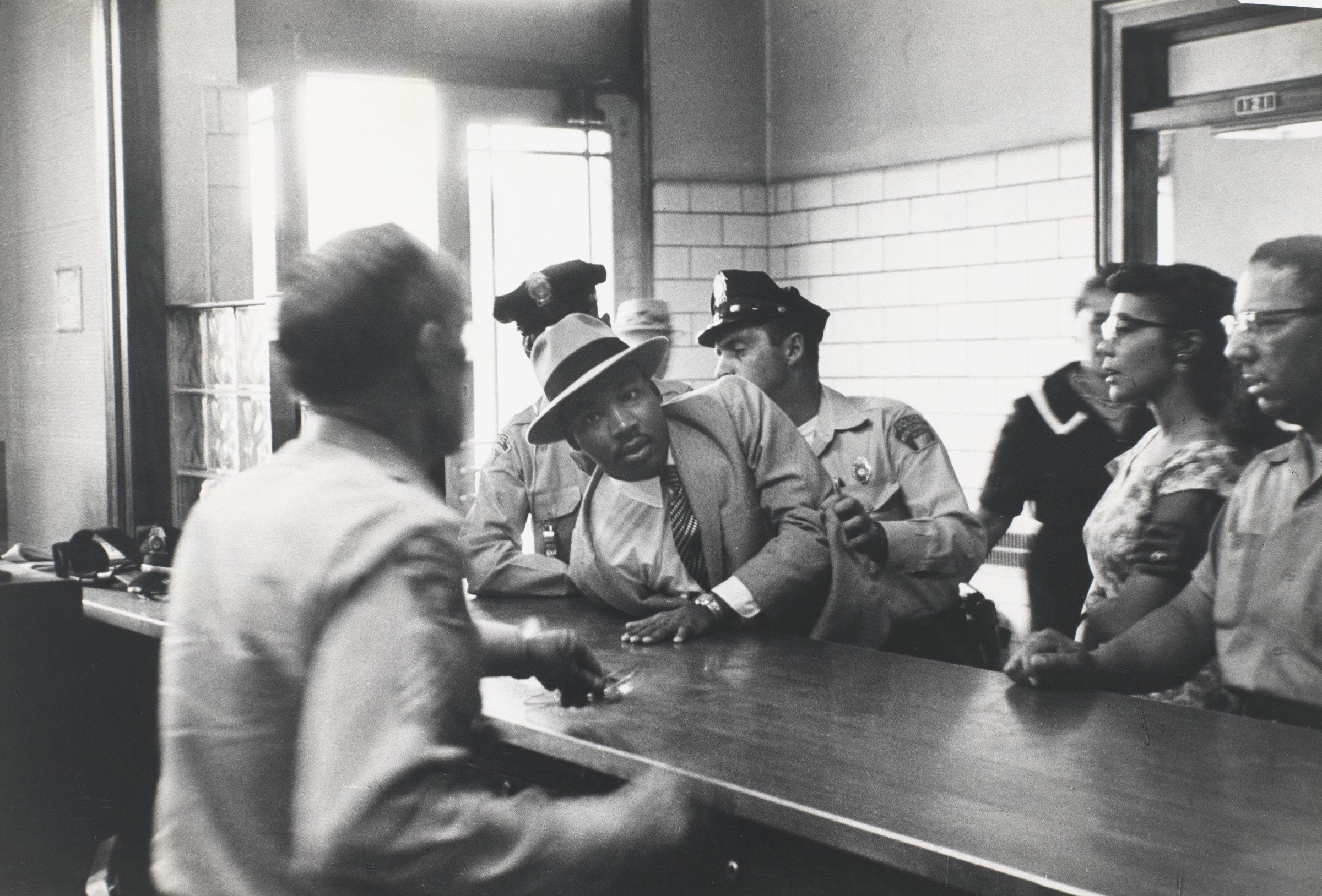 Charles Moore (American, 1931–2010), Martin Luther King Jr. Arrested, Montgomery, Alabama, 1958, gelatin silver print, High Museum of Art, Atlanta, purchase with funds from Lucinda W. Bunnen for the Bunnen Collection, 1994.63. © Estate of the artist.