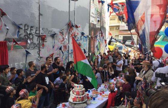 Banksy Throws An "Apology Party" for the Balfour Declaration in Palestine