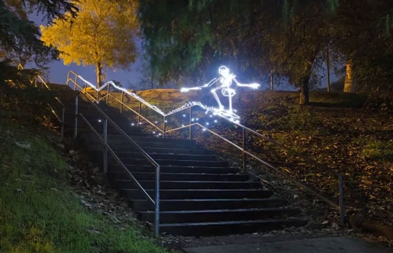 A Skateboarding Light Painted Skeleton